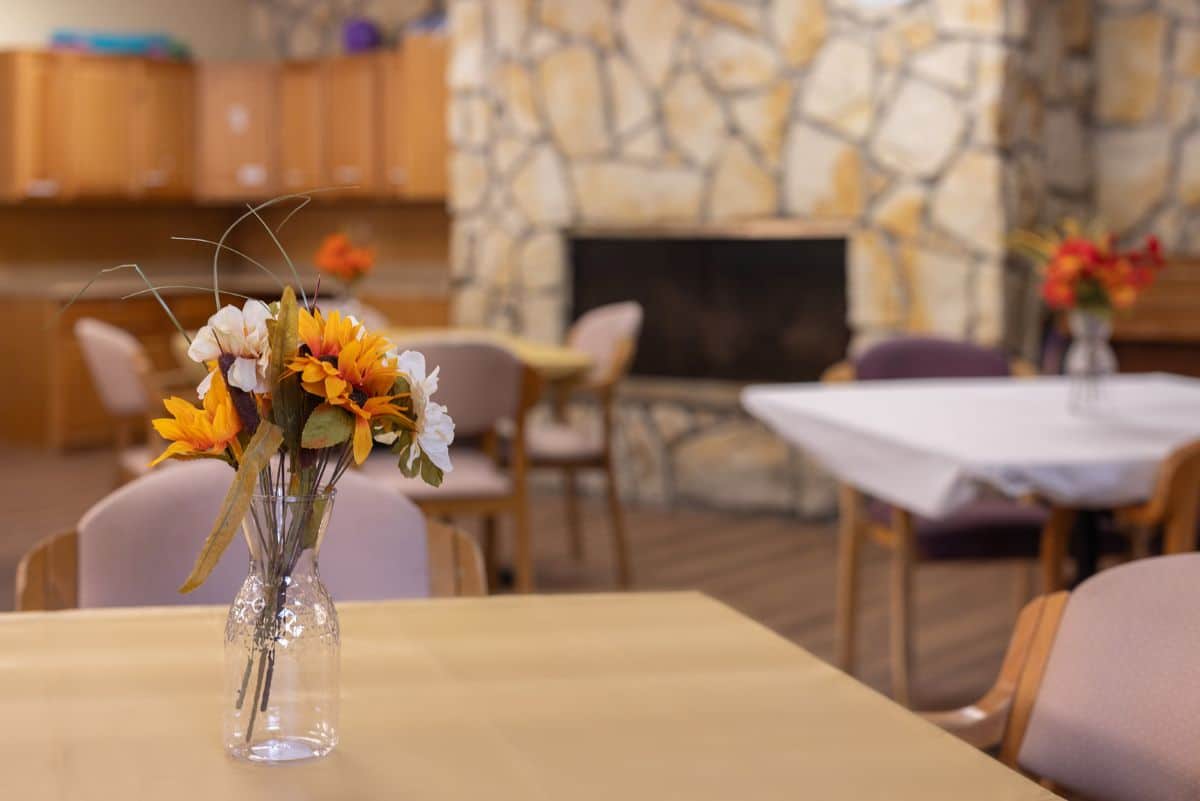 View of flowers on dining room table at Northpointe Care Center